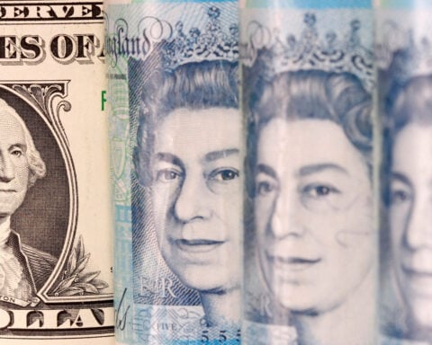 Pound little changed as US trade deal touted, BoE rate cut eyed