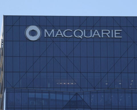 Australia's Macquarie reports FY profit rise, signals domestic upside