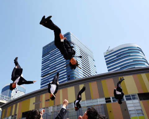 Japanese 'salarymen' inspire with cheerleading acrobatics