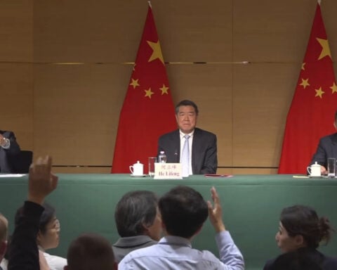 World trade chief says global free trade is in a crisis while on visit to Japan