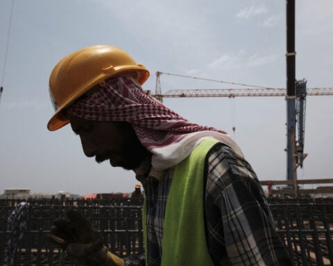 Rights groups say migrant workers are dying on Saudi job sites as kingdom prepares for World Cup