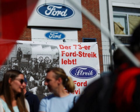 Workers strike in protest against job cuts at Ford Germany