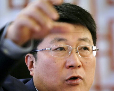 China hands Tsinghua Unigroup's former chairman suspended death sentence over corruption