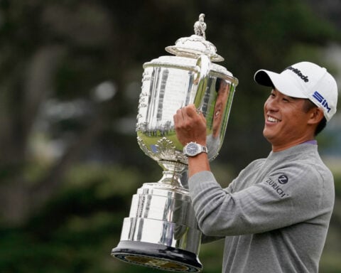 Don't drop it! The PGA Championship's 27-pound Wanamaker Trophy can be a beast to hoist