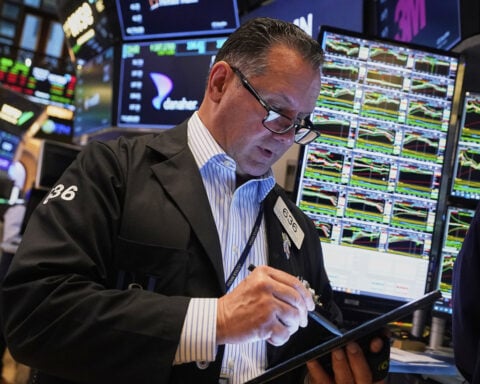Asian shares are mostly lower after a mixed session on Wall Street