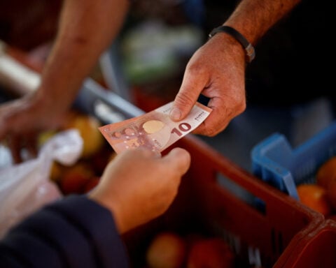 Euro zone growth downgraded but employment holding up
