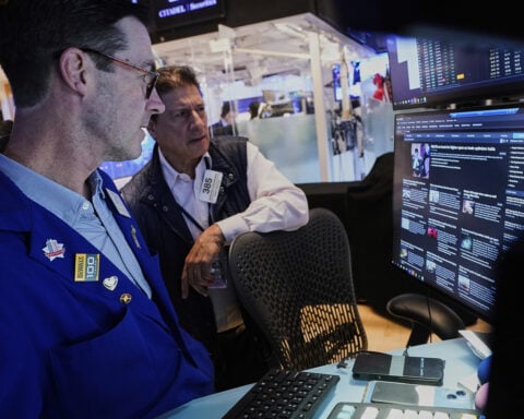US stocks power within 3% of their record as Wall Street closes out a winning week
