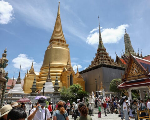 American academic in limbo in Thailand over royal insult case, family says