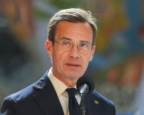 Swedish PM says jailed reporter on his way home from Turkey