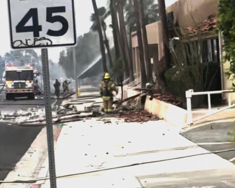 Police and firefighters respond to an explosion rocking the California city of Palm Springs