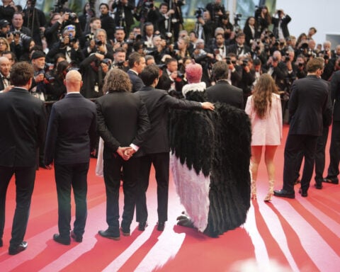 Bird man on red carpet leaves Cannes squawking
