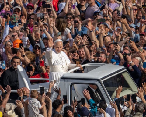 Pope Leo XIV offers message of unity for polarized Catholic Church as pontificate officially starts