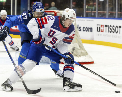 US scores 5 goals in middle period to rout Kazakhstan and advance at ice hockey worlds