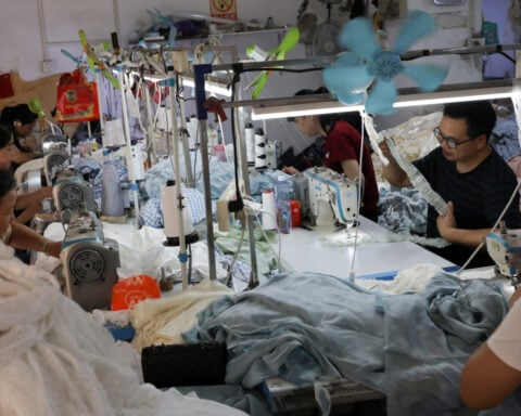 China's factory output resists tariff impact, retail sales disappoint