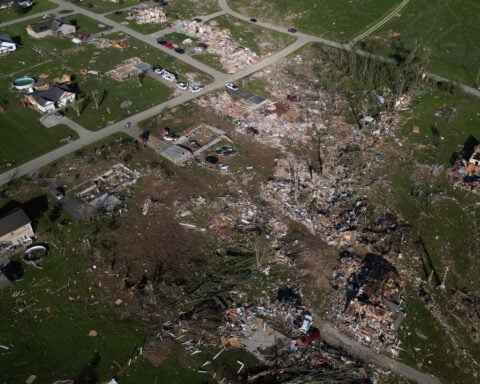 Strong tornadoes threaten millions more in the central US after a weekend of violent storms that left at least 28 dead