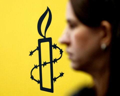 Russia bans Amnesty International, which vows to redouble work on rights abuses