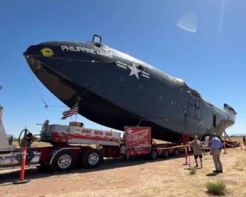 A big, big, piece of aviation history draws crowds on Arizona roads