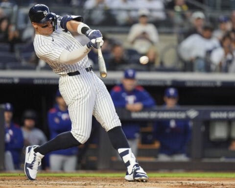 Judge homers late and Yankees beat Rangers 5-2 behind Warren and Rice