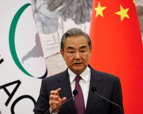 China's foreign minister meets acting Afghan counterpart