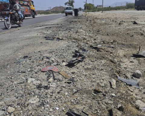 A suicide car bomber strikes a school bus in Pakistan, killing 5