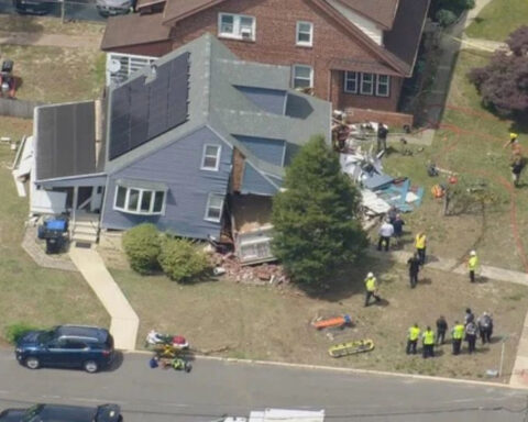 Dump truck slams into home in New Jersey