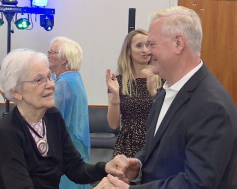 Memory care residents dance through time at prom