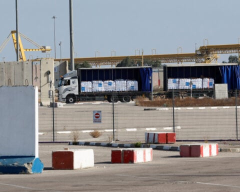 Aid trucks enter Gaza after delays, as pressure mounts on Israel