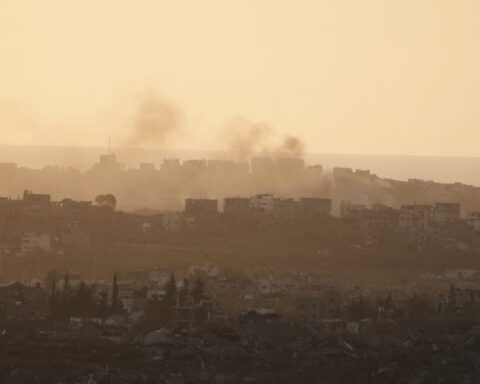 At least 60 people killed by Israeli strikes in Gaza as Israel lets minimal aid in