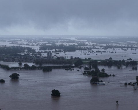 Death toll in Australia floods rises to four, tens of thousands stranded