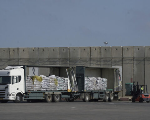 Israel may change tack to allow aid groups in Gaza to stay in charge of non-food aid