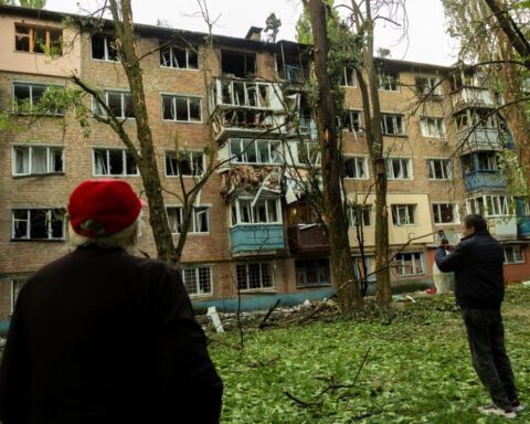 Russian drone fragments set Kyiv apartment building ablaze, official says