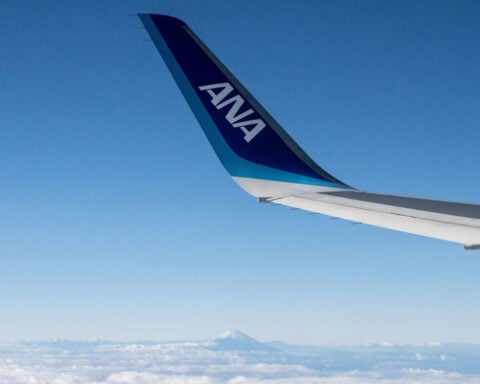 Flight from Tokyo diverted to Seattle after passenger tries to open exit door in flight