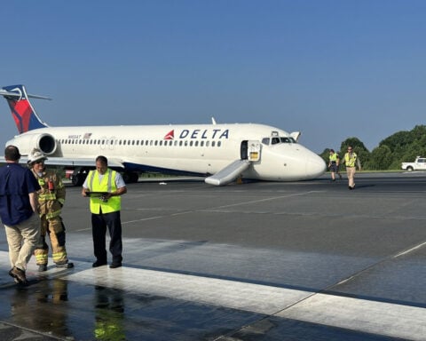 Delta flight could not lower landing gear because of broken support piece, NTSB finds