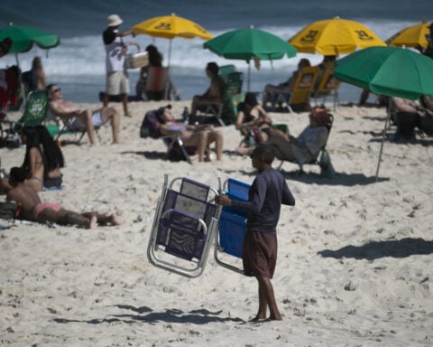 Rio’s mayor eases his new rules on live beach music after an outcry