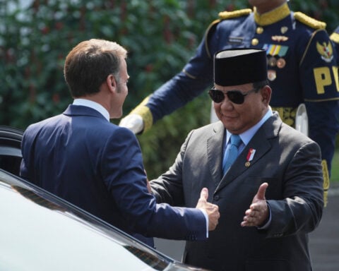 France's Macron presses ahead in his Southeast Asia tour with talks in Indonesia