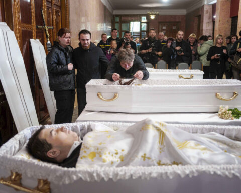 Funeral of 3 siblings killed in Russian strike underscores mounting toll on Ukrainian families