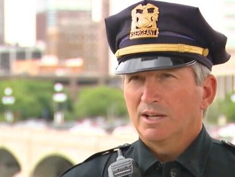 Des Moines police talk a man from the ledge of the top floor of a downtown parking ramp