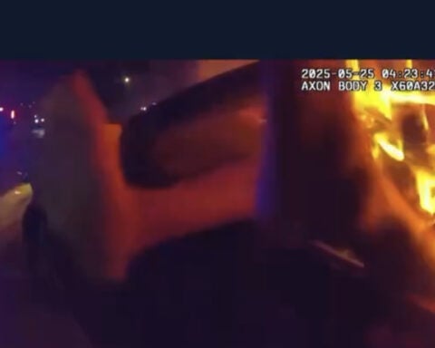 Police officer rescues woman from burning car