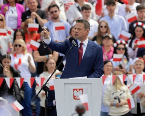 Poland’s ruling party candidate leads opinion poll ahead of Sunday vote