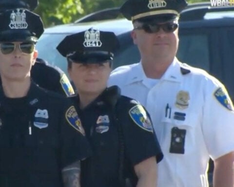 Baltimore, Anne Arundel County police support fallen officer's daughter at high school graduation