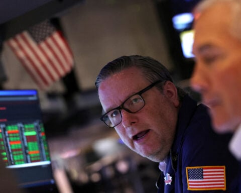 Stocks rise, dollar pares gains as markets grapple with US trade ruling