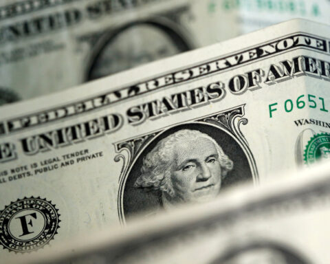 Dollar mixed on tariff uncertainty, headed for monthly gain against yen