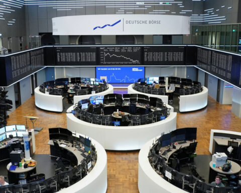 Stocks finish lower but notch strong monthly gain despite tariff worries