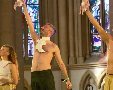 A show inside a cathedral featured raw chickens in diapers. The German president was in the audience