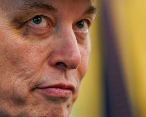 X marks the spot: Bruised Musk says his young son punched him