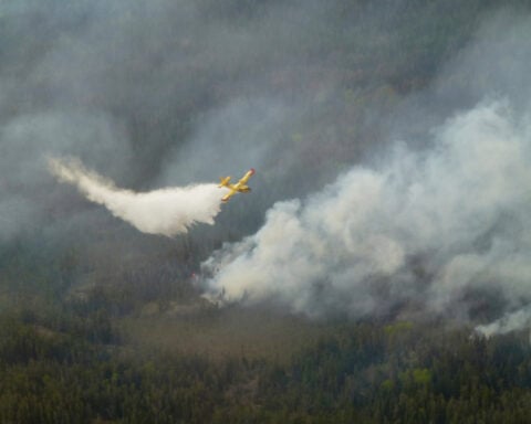 Wildfires burning across central Canada force additional evacuation orders and more shelters to open