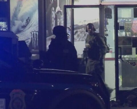 Man taken into custody after hours-long standoff at gas station