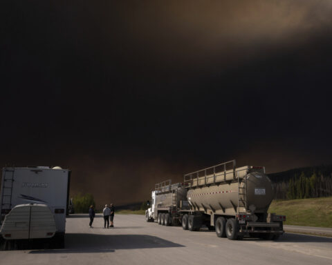 Wildfires burning across central Canada force additional evacuation orders and more shelters to open