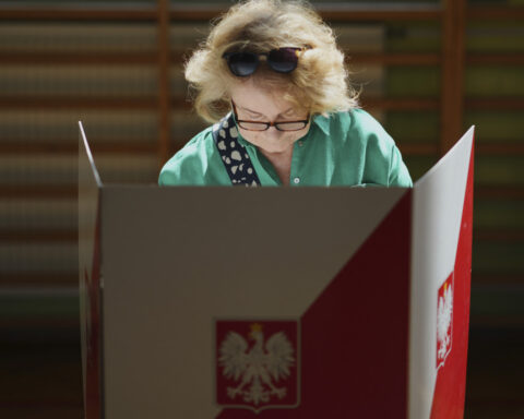 Poland on a knife’s edge as exit polls show a near tie in runoff