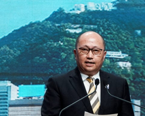 Hong Kong leader says sudden removal of China's top official in the city was "normal"